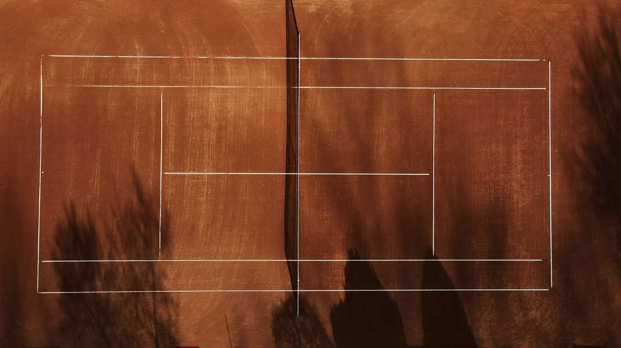 Aerial view of red clay tennis courts at Trailside Tennis Club