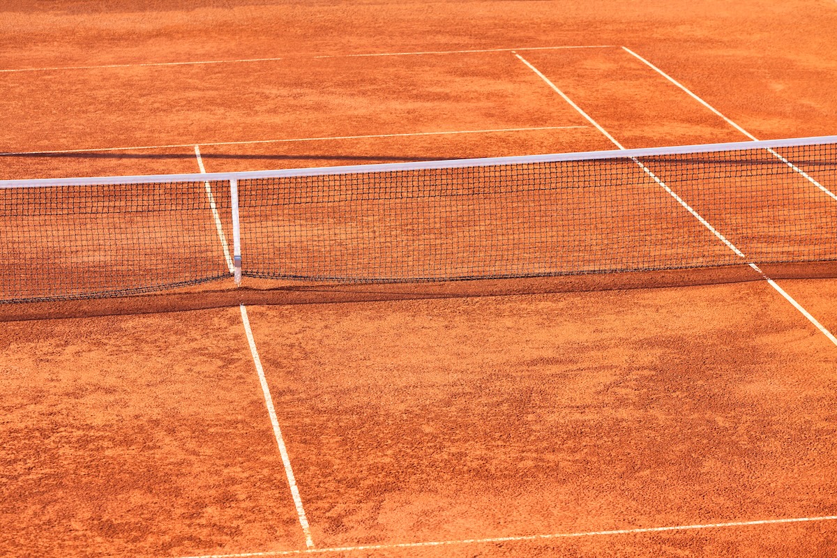 Red clay tennis courts at Trailside Tennis Club in Ormond Beach